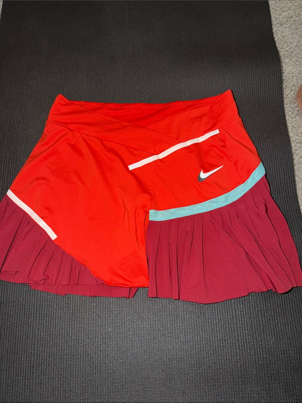 Nike Women's Red Skort with Maroon Pleated Hem and Teal Trim